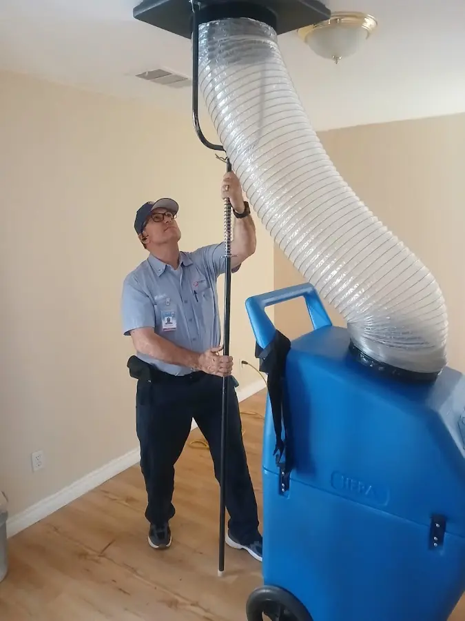 Furnace Tune-Up technician using HEPA equipment in Springboro